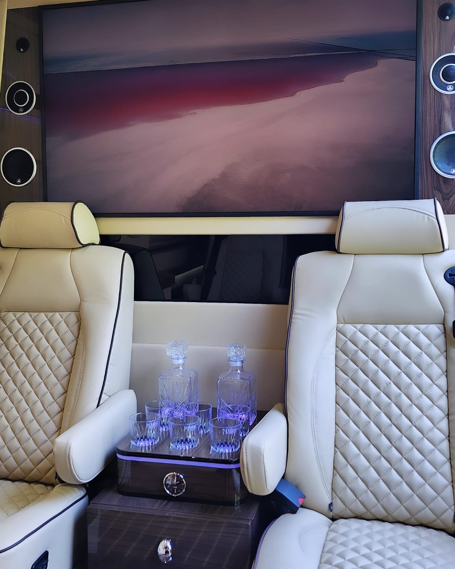 The beverage station and screen in the executive Sprinter cabin