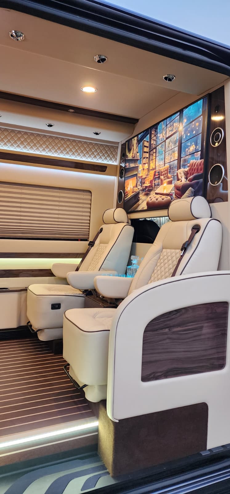 A pull-out table and screen in the executive Sprinter cabin